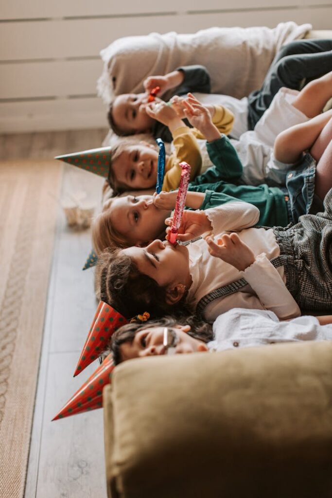 Kids Lying on the Couch During a Birthday Party